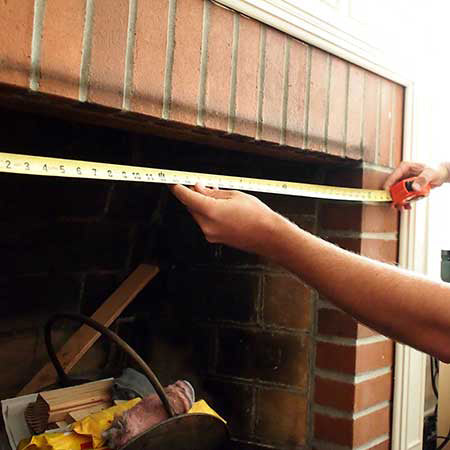 measuring the inside of a fireplace
